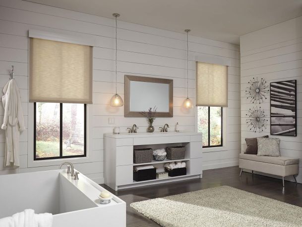 Modern bathroom with smart window shades and elegant decor.