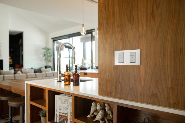 Minimalist kitchen with a sleek wall-mounted control panel.